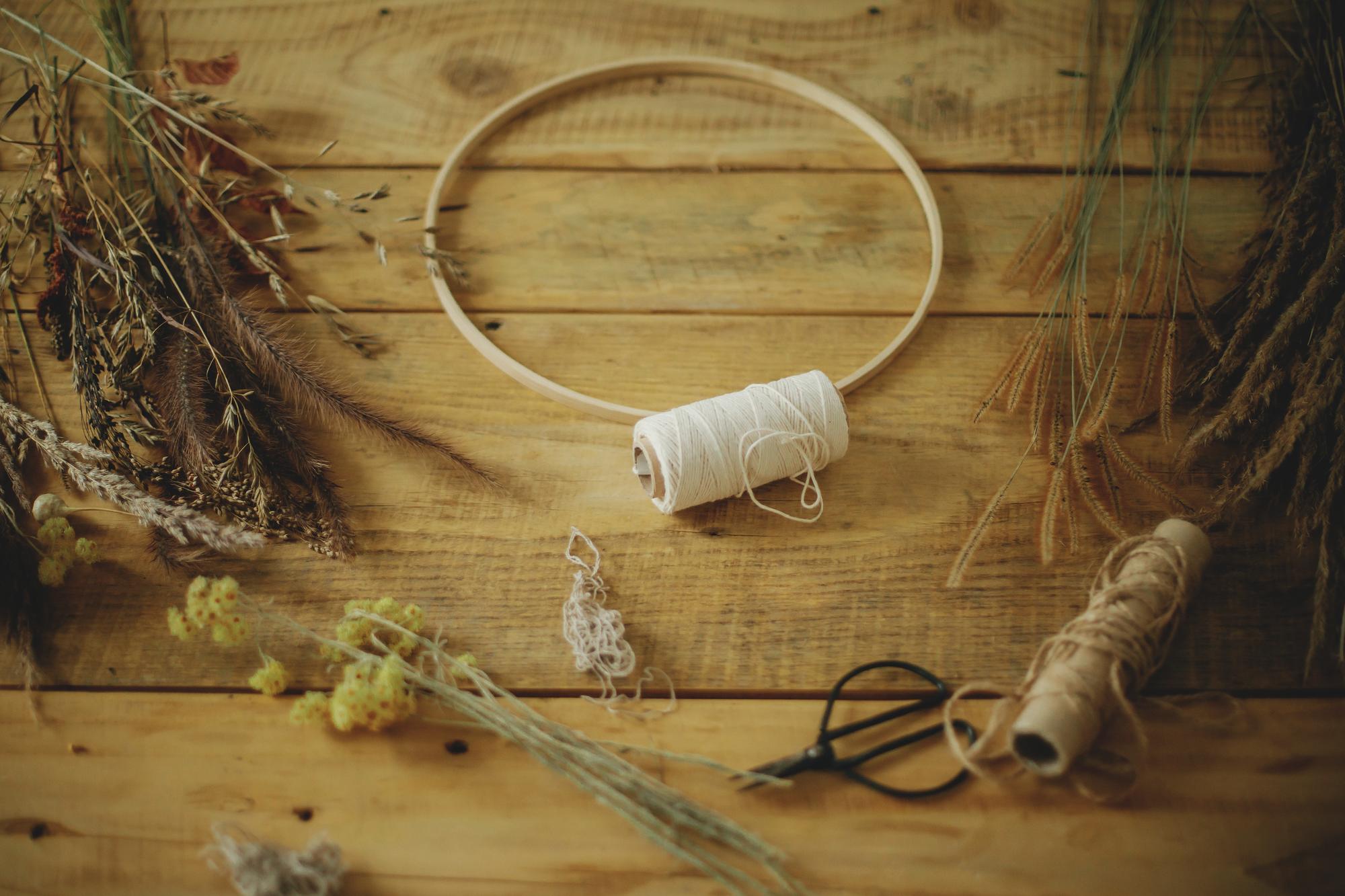 Workshop table with threads and embroidery hoops